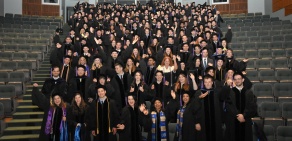 photo of law graduates cheering. 