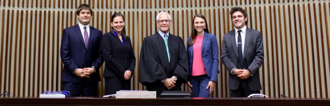 US Court of Appeals Judge Julio M. Fuentes ‘75 posing with UB law interns. 