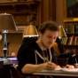 UB students studying in a library. 
