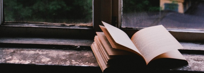 Photo of book on windowsill. 