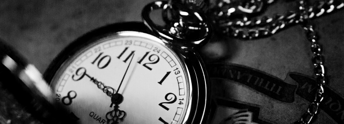 Black and white photo of a pocket watch. 