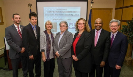 Left to right: Roman Fontana of Veterans One-stop Center of WNY, Clinical Teaching Fellow Cody Jacobs, Grace Andriette of Neighborhood Legal Services, Donna Li Puma of WNY Veteran’s Administration, Professor and Clinical Legal Education Director Kim Diana Connolly, Law Dean Makau Mutua and UB Provost Charles F. Zukoski. 