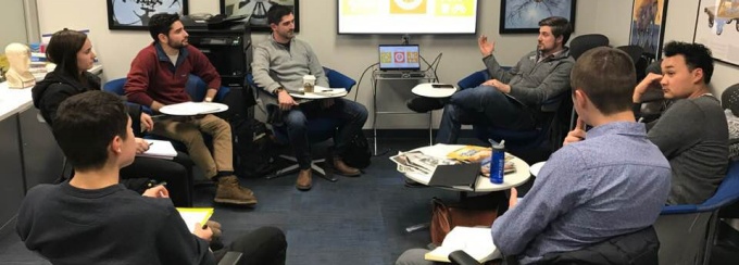 Pelkey with law students from the Entrepreneurship Law Center meeting with UB’s Blackstone LaunchPad to help them prepare their pitches for the World’s Challenge Challenge, a program that calls on students to solve some of the problems facing the world. 