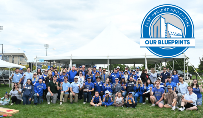 UB Law students, faculty, and staff dressed in blue at a UB Bulls tailgate event. With a Blueprint visual that has an O'Brian Hall outline that says Our Blueprints: Past, Present and Future. 