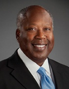 a professional portrait of a man wearing a busines suit. 