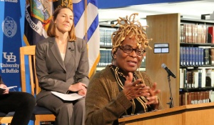 woman talking at a podium. 