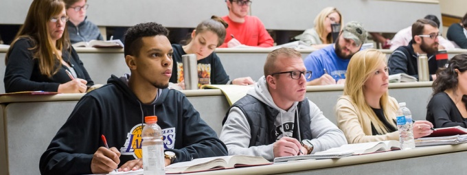 law students attending a classroom lecture. 