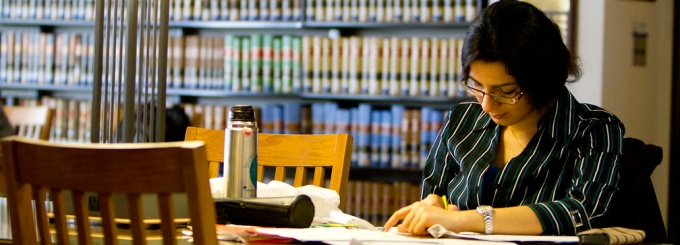 photo of a student studying in the law library. 