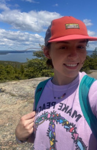 Hannah outside wearing a cap. 