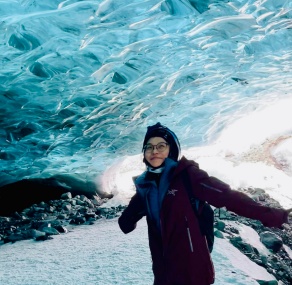 woman standing out in the snow and ice. 