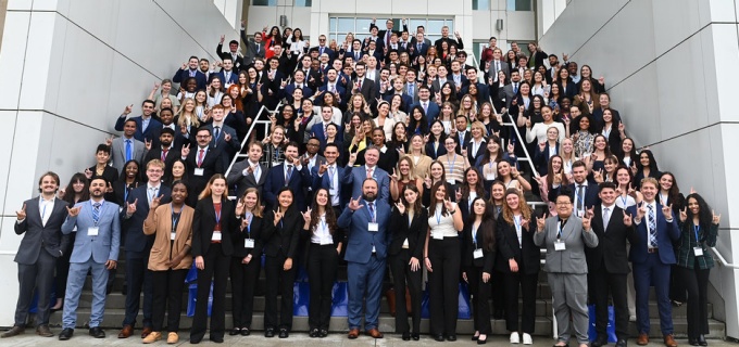 photo of the entire JD Class of 2026 standing on a large stairway. 