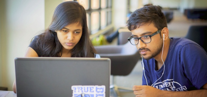Students using laptop computer. 