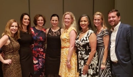 Alumni posing together for a photo. 