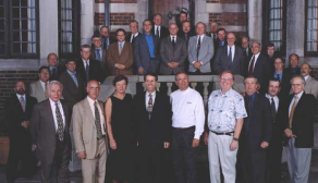 group of alumni posing outside for their group photo. 