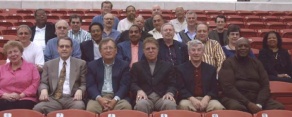 group of alumni posing outside for their group photo. 