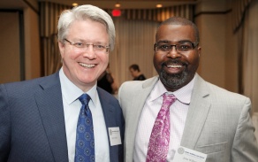 two men smiling. 