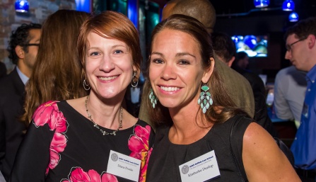 two women smiling. 