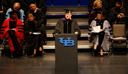 man speaking at a podium. 