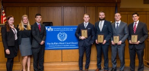 Desmond winners and judges posing with their awards. 