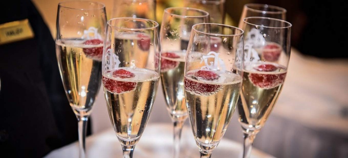 closeup view of champaign glasses on a tray. 