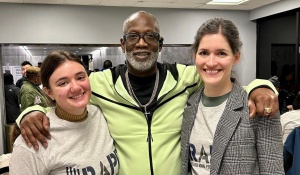 Jerome Wright with a student attorney and Alexandra Harrington.