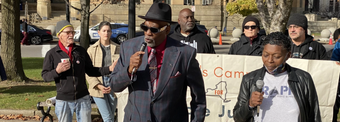 Jerome Wright giving a speech at a parole advocacy event.