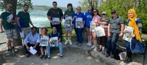 Zoom image: Law students showing off their Ramsar Bingo cards. 