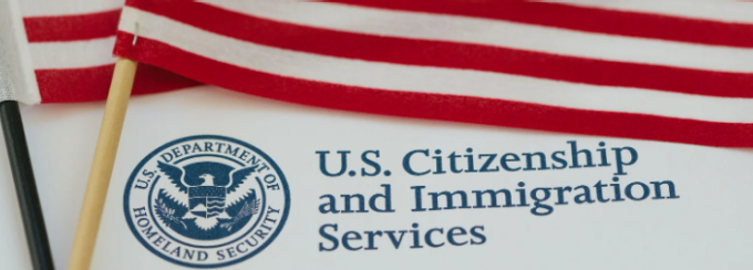 U.S. Department of Homeland Security logo with two American flags. 