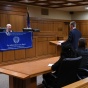 student in courtroom during a moot court competition. 