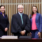 US Court of Appeals Judge Julio M. Fuentes &lsquo;75 posing with UB law interns. 