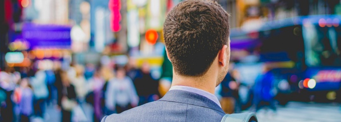 photo of a young professional male in new york city's times square. 