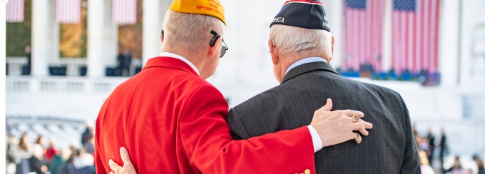 Visitors attend the Veterans Day observance at Arlington National Cemetery’s Memorial Amphitheater in Arlington, Va. 