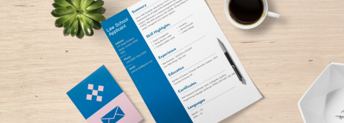 photo of resume on a desk with a cup of coffee and a cactus. 