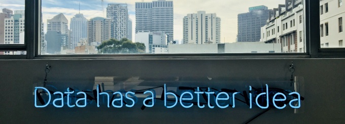 photo of a neon sign that reads "Data has a better idea". 