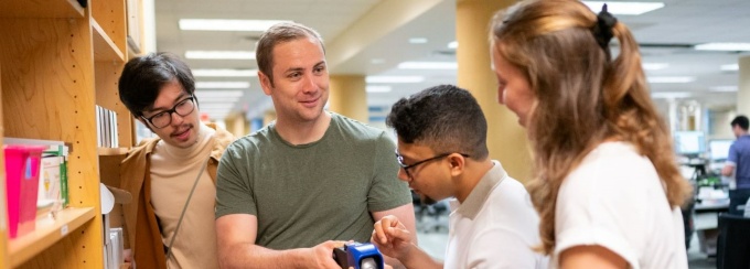 Four UB students having a conversation. 