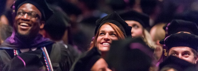 Two graduating law students enjoying law school graduation. 