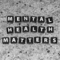 Close up image of black and white letters spelling out Mental Health Matters. 