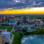 Ariel photo of UB's North Campus with a sunset. 