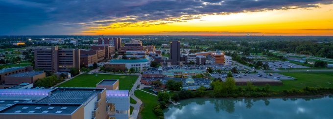 Ariel photo of UB's North Campus with a sunset. 