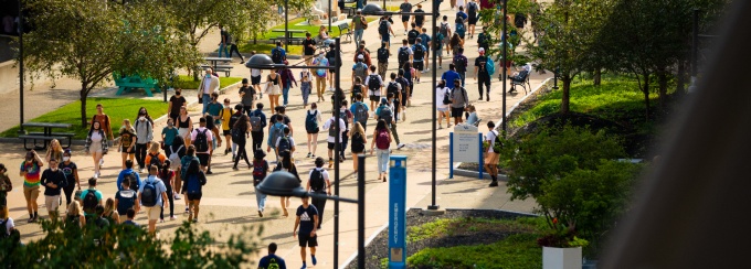 group of students walking on campus. 