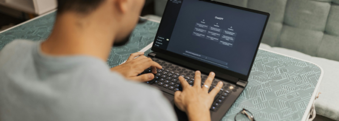 Person using a laptop displaying an AI chatbot interface. 