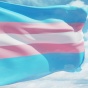 Transgender flag waving in the sky. 
