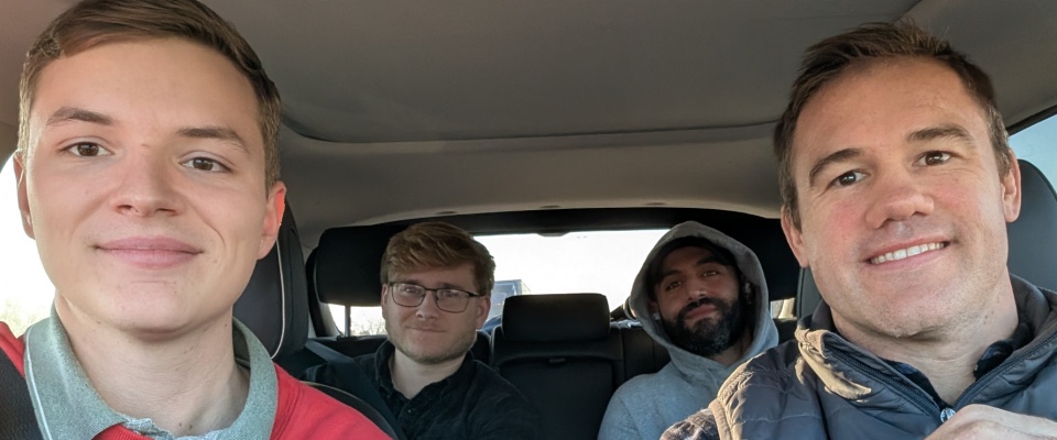 Image of Wayne Evans, Cameron Marsh, Keenan Englerth and Jonathan Khoury in a car. 