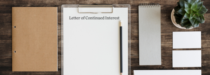 Paper on desk that says Letter of Continued Interest. 
