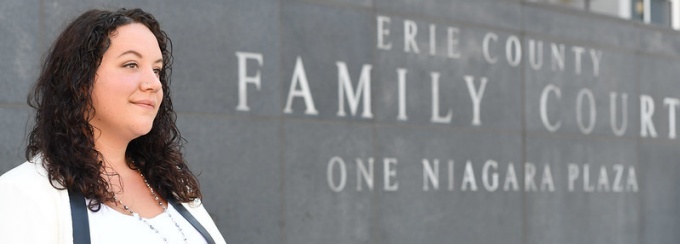 Close up image of Victoria Roden, JD Class of 2021, in front of Erie County Family Court. 