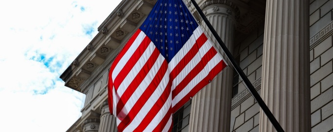 flag in front of government building. 