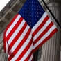 flag in front of government building. 