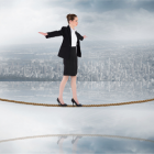 woman walking a tightrope. 
