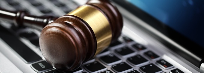 image of a laptop on a wooden desk. 