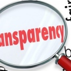 illustration of words on a page with the work Transparency in red and under a microscope. 